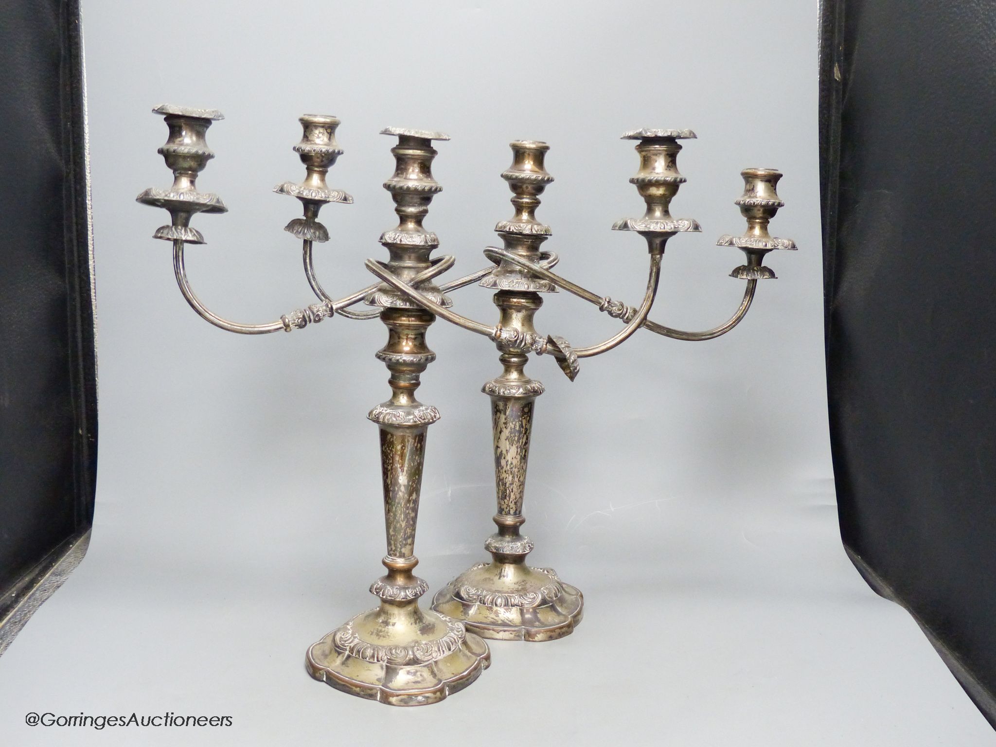 A pair of silver plated two branch three light candelabra, height 40cm